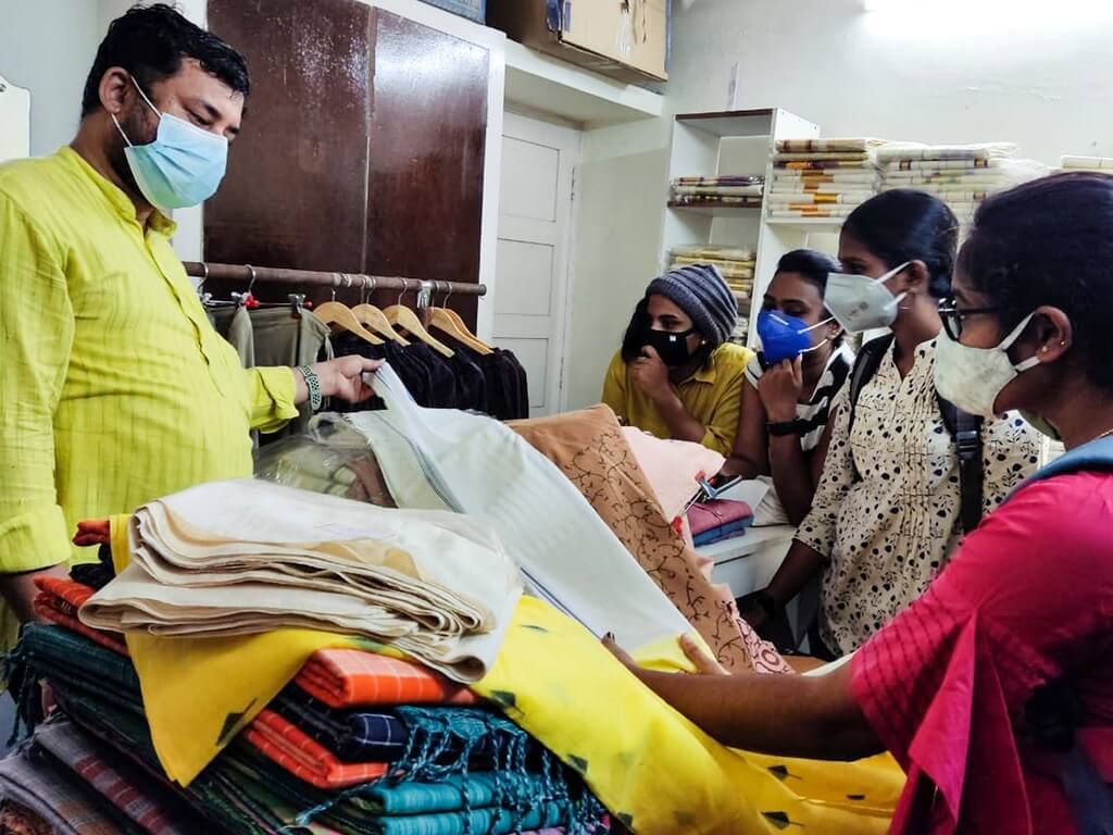 Industrial Visit To Gramins Lifestyle: Students at the unit understanding the textile fabrics and their weaves